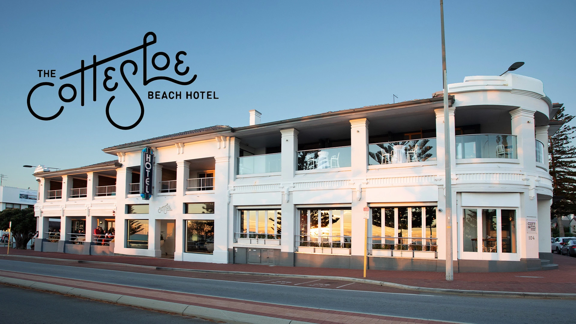 The Cottesloe Beach Hotel white colonial building exterior from street level with the Cottesloe Beach Hotel script branding visible